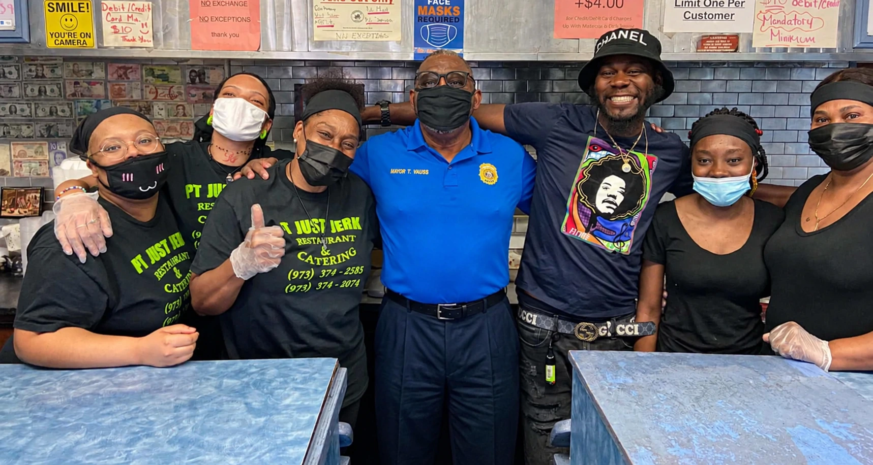 Tony Vauss visiting a local business with community members